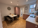 Open plan kitchen dining room with fully fitted appliances 