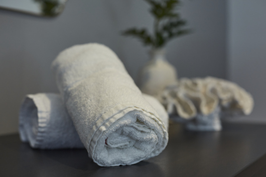 Settle into this serene double bedroom — a peaceful space to recharge.