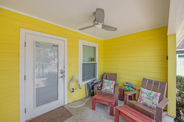 patio has 2 chairs with ottomans, a hose with spray and 2 backpack style chairs you can take to the beach