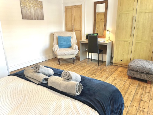 Bedroom 3 - Spacious room with comfy double bed, wardrobe, armchair and desk workspace