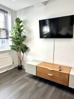 Beautiful large bedroom with stunning natural light, gorgeous artwork, smart TV, desk with comfy chairs, lamp, wardrobe, chest of draws and everything else you need for a perfect stay!