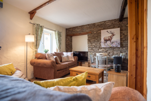 Open-plan lounge, dining and kitchen space designed for relaxed family holidays and countryside escapes.