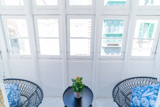 Maltese old balcony with cosy seating area