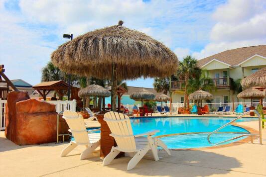 Larger pool has palapas for shade, plenty of seating/chaise loungers . 