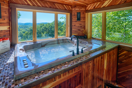 Couple's Jacuzzi, in Cupola, with views of treetops and valley, Soaring Eagle Luxury Treehouse