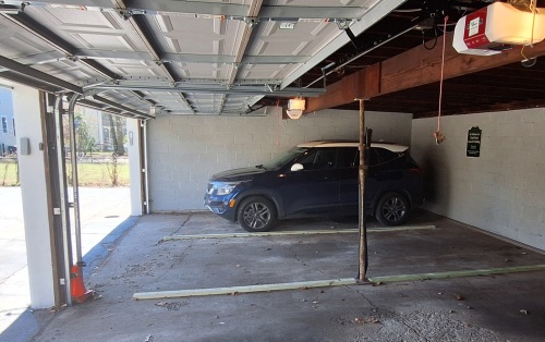 Spacious garage fits two cars.