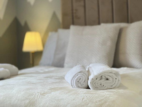 Bright and spacious bedroom designed for relaxation and comfort.