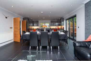 Dining area with a clear view into the expansive open-plan kitchen, creating an easy, social flow for group meals and gatherings.