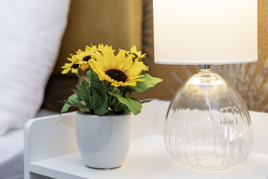 Thoughtful Interior Styling - Soft lighting and floral décor create a calm, welcoming atmosphere