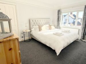 Relax in this spacious bedroom featuring a luxurious super king bed. With stylish décor and a calming atmosphere, it’s the perfect retreat for a peaceful night’s sleep.







