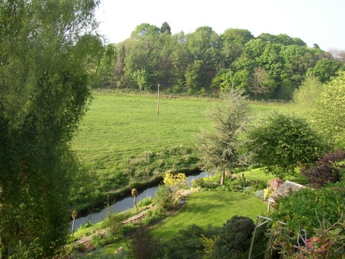 View from dining area across the garden and valley beyond