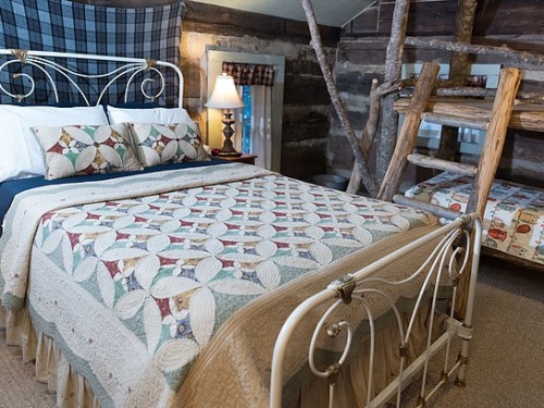 The Daniel Boone room features unique decor and furnishings, including a kid-friendly bunk bed.