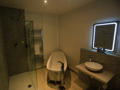 "Hartland" bathroom complete with slipper bath and double walk in shower