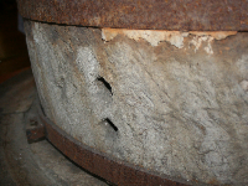 The grist mill where grits and cornmeal were ground is still intact.  The running stone, weighs approximately 2,000 lbs and rotates counterclockwise over the stationary stone.