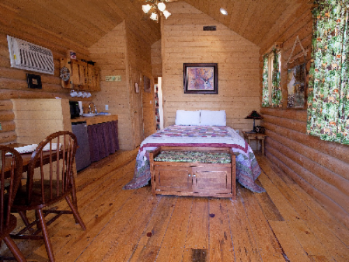 Main room of the cabin has a queen bed; kitchenette area; Dining area; Heat and A/C; TV.  Only different inside is decor.  All towels and linens provided.