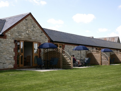 Rear view of the cottages showing cottages garden & individual screened patios