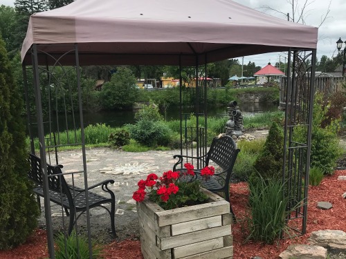 Read a book or have a conversation beside the river in our Meditation Garden