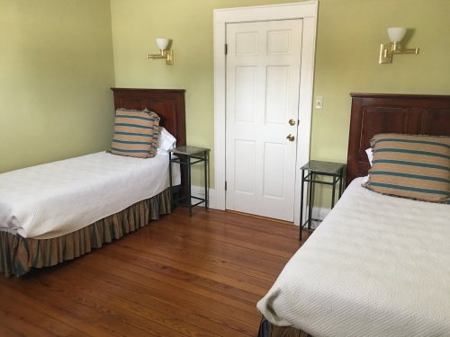 The Smith Room of the Dashiell-Smith two bedroom suite features two twins, perfect for children of friends on a getaway and is located on the second level of the Garden House.