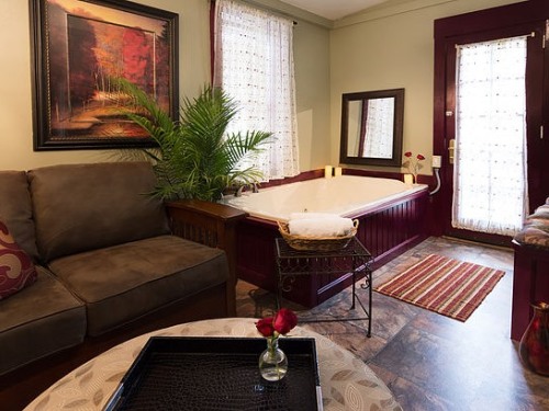 The luxurious Suite has a jetted tub, a kitchenette, and an outdoor sitting area overlooking the creek.
