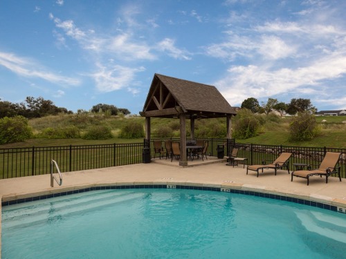 Pool and BBQ pit are for condo guests to enjoy.