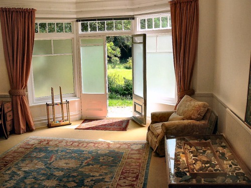 The guest sitting room opens onto the gardens