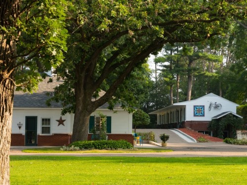 The property is comprised of three distinct buildings. The carriage house (left) suites 1-3, and the historic motor lodge (right) rooms 4-9.  The house (not pictured) is lobby and breakfast room.