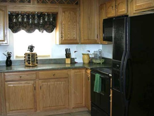 Fully equipped kitchen with electric stove, microwave, full size refrigerator/freezer and dishwasher.