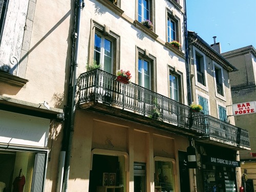 Street view of apartments and wine shop