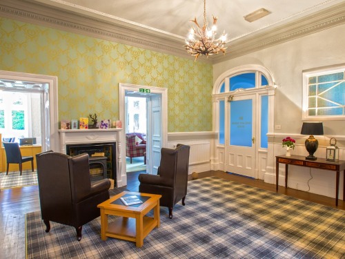 The spacious foyer is warm and welcoming