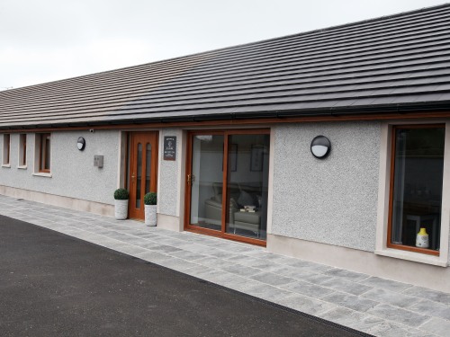 Outside view of dining room, reception area and bedrooms