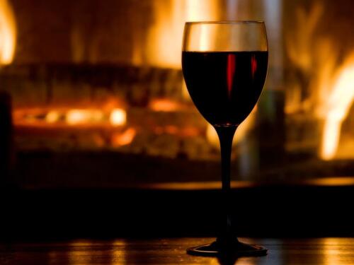Enjoy a drink in front of the open fire