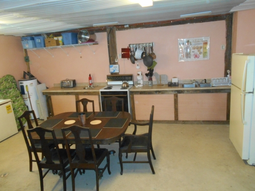 Self-catering kitchen and dining area on first floor.