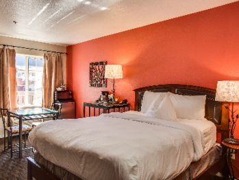 Single Queen room with Pillowtop Bed dressed in Luxurious Linens and Down Comforter, Flatscreen Television, Microwave, Mini Refrigerator and Coffeemaker.