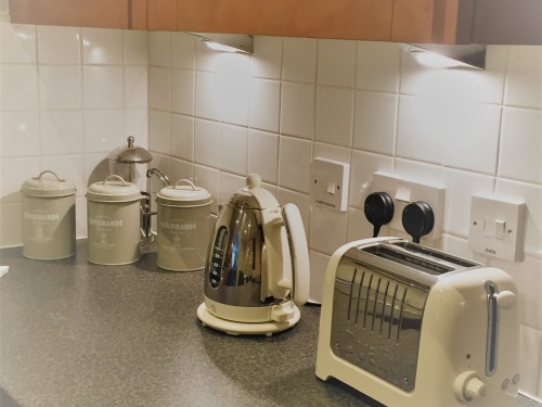 Fully equipped kitchen with dishwasher, washing machine fridge freezer, cooker, hob and washing machine.