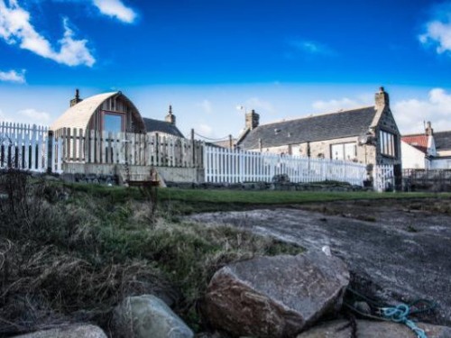 "Pew with a View" and "Door to the Shore", spectacular seafront cottages with secure fence