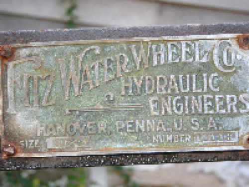 The historic early 1900s Fitz Water Wheel is propelled by the running water of the creek.
