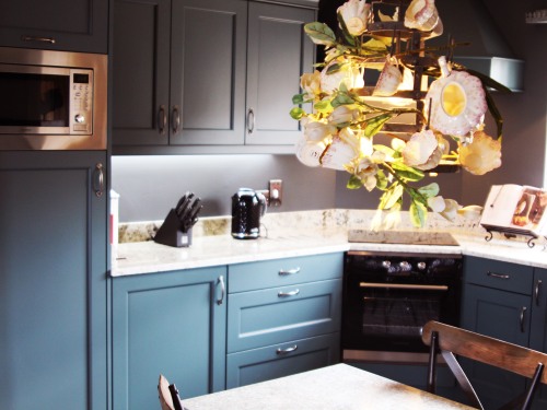 Kitchen with granite work top & built in appliances.