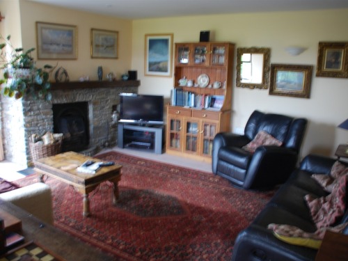 Guest Sitting Room with  Sky TV video DVD and Log Fire