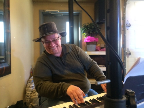 Fat Fingers Slimm pounding out a song.