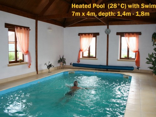 Heated pool with swim jet