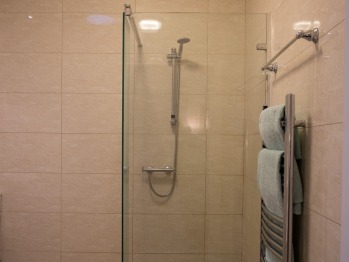 Oak cottage wet room bathroom with separate shower & bath