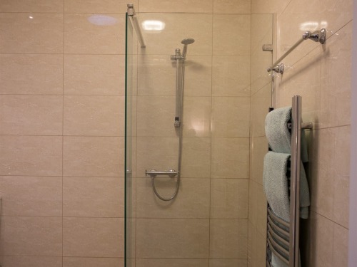 Oak cottage wet room bathroom with separate shower & bath