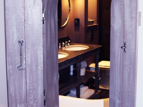 Glimpse of bathroom with shutters open