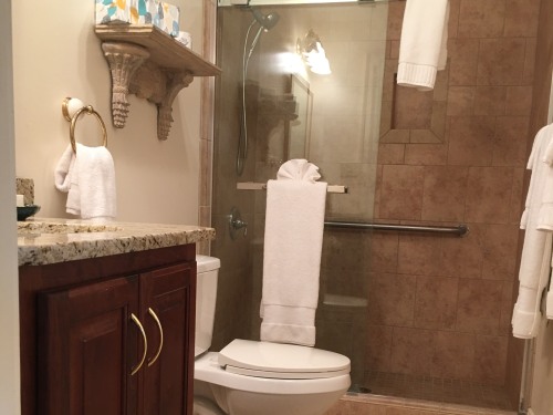 The Sinclair room bathroom offers the privacy of an ensuite with ease of walk in, accessible shower.
