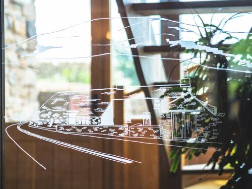 The Wayside logo beautifully etched on the glass wall in the dining room