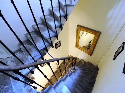 Beautiful period feature staircase to the apartments.
