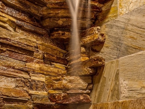 Stone waterfall shower in Castle suite