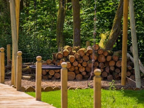 Garden - boardwalk and playground with swings, trampoline and zip wire
